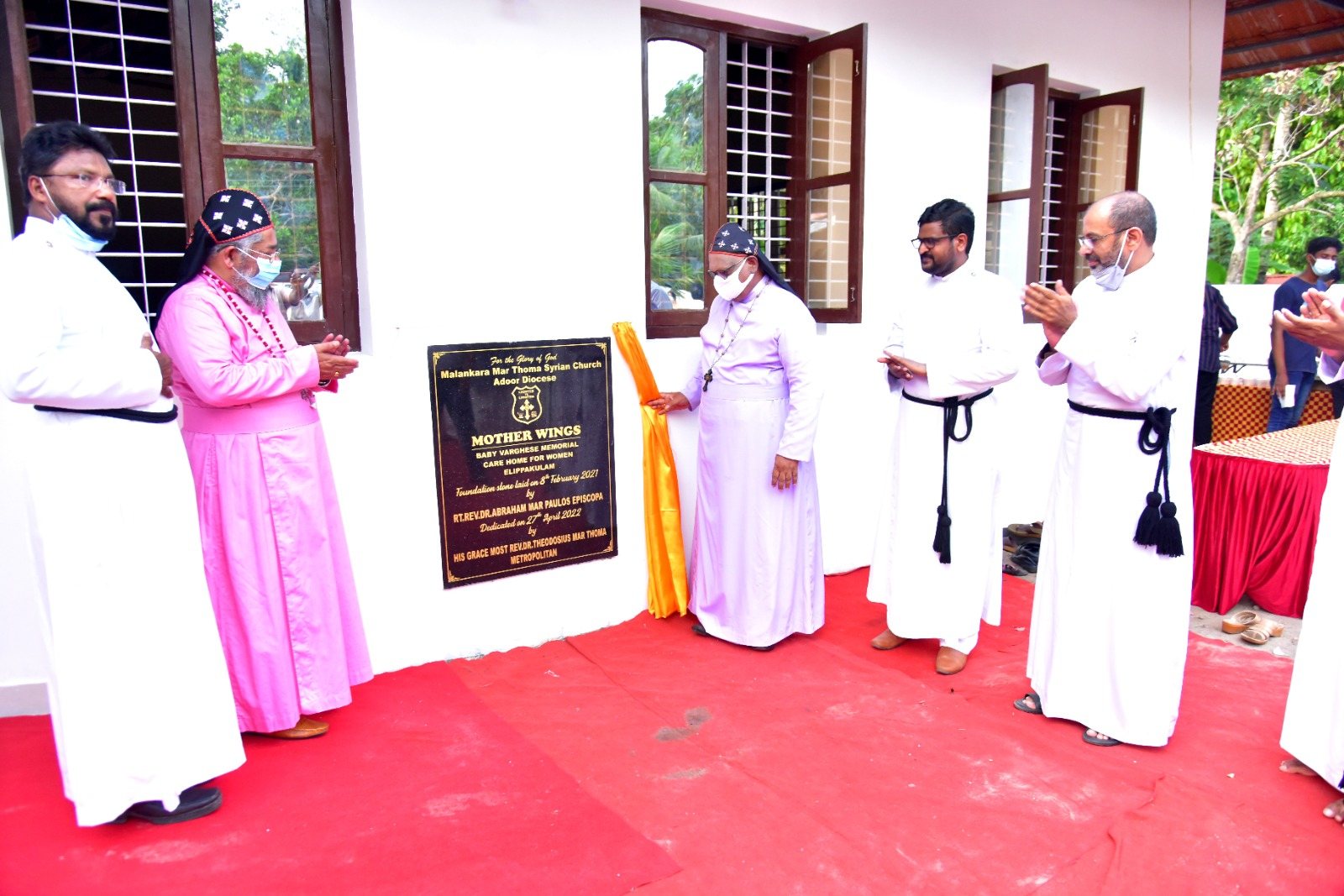 Clergy and guests gathered for the dedication of the home